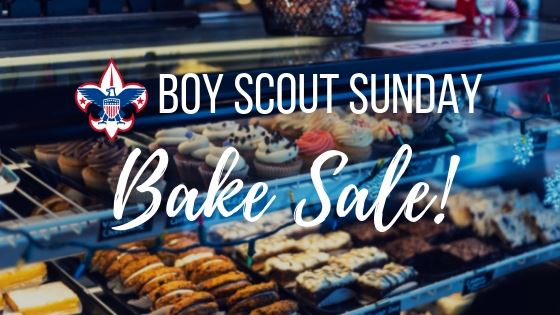 pastries displayed in a bakery with "Boy Scout Sunday - Bake Sale!" over
