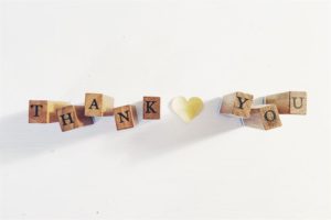 Thank you spelled out with wooden blocks