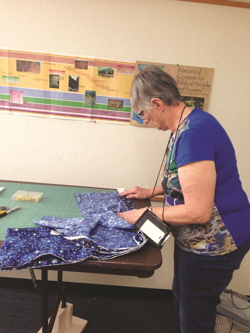 Heart of Longmont United Methodist Women making pads for girlsv