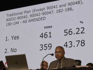 As the Rev. Joe Harris presides over the legislative committee, the results of a vote approving the Traditional Plan as amended by 461-359 are displayed. The vote must still be approved by the plenary session on Feb. 26, the final day of the special session of the 2019 General Conference of The United Methodist Church in St. Louis. Photo by Paul Jeffrey, UMNS.