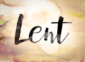 The word "Lent" written in black paint on a colorful watercolor washed background.