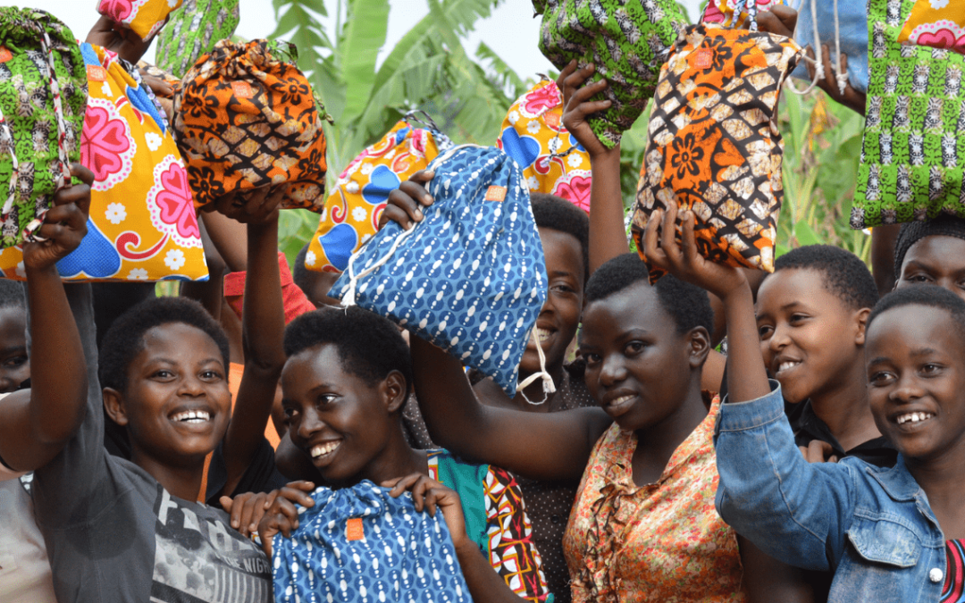 Photo of young women with Days for Girls kits. Image used courtesy of Days for Girls.