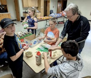 HOL Youth preparing Chef Hearty bags.