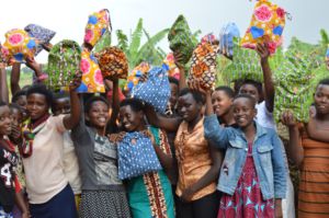 Girls celebrating with Days for Girls kits in Rwanda, courtesy Days for Girls International