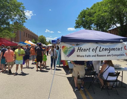 A photo of the HOL booth at Longmont's Pride Festival 2022