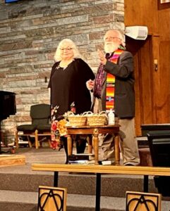 A photo of Pastor David and his wife Rebecca at Sunday worship.