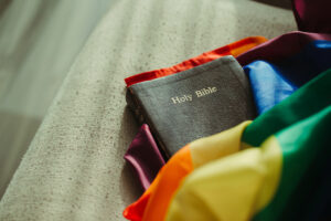 The Holy Bible on rainbow flags, which are the colors that the transgender LGBT community use to show their PRIDE.