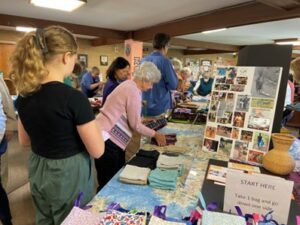 volunteers putting together Days for Girls menstrual hygiene kits
