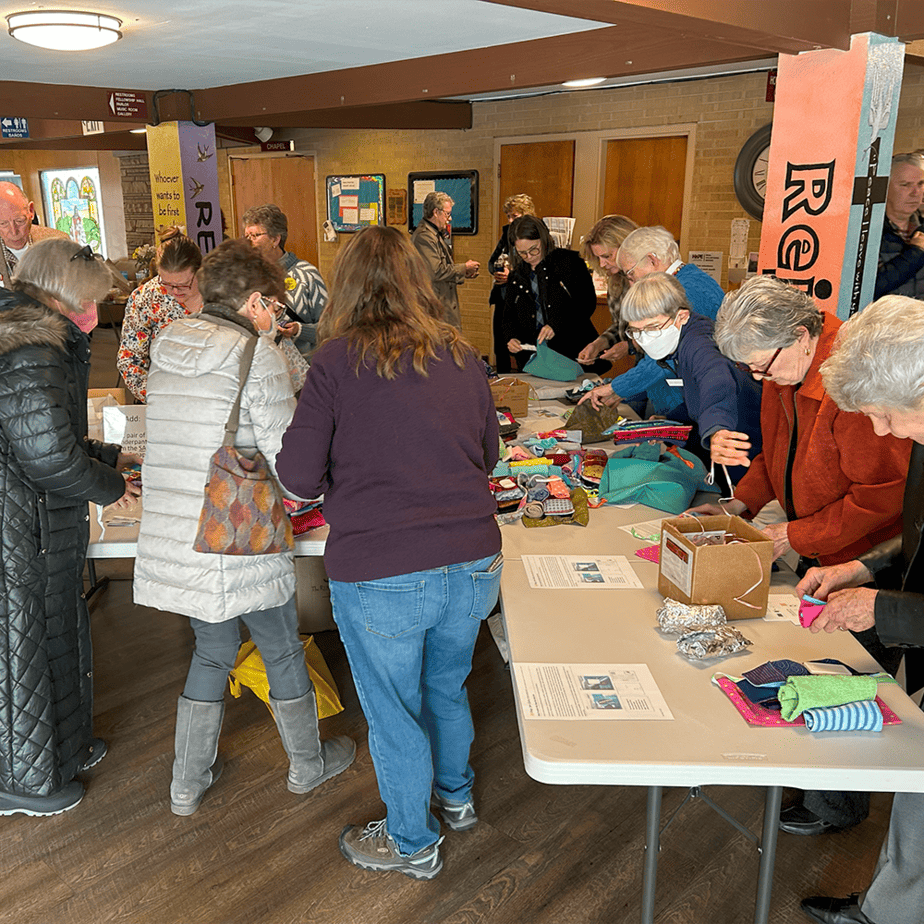 Volunteers building menstrual health kits for Days for Girls